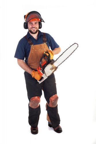 Man dressed in appropriate chainsaw safety clothing and equipment